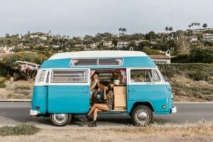 a romantic couple sitting inside the campervan