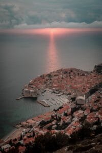 city on an island and sunset over sea