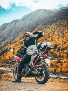 biker exploring autumn mountain landscape