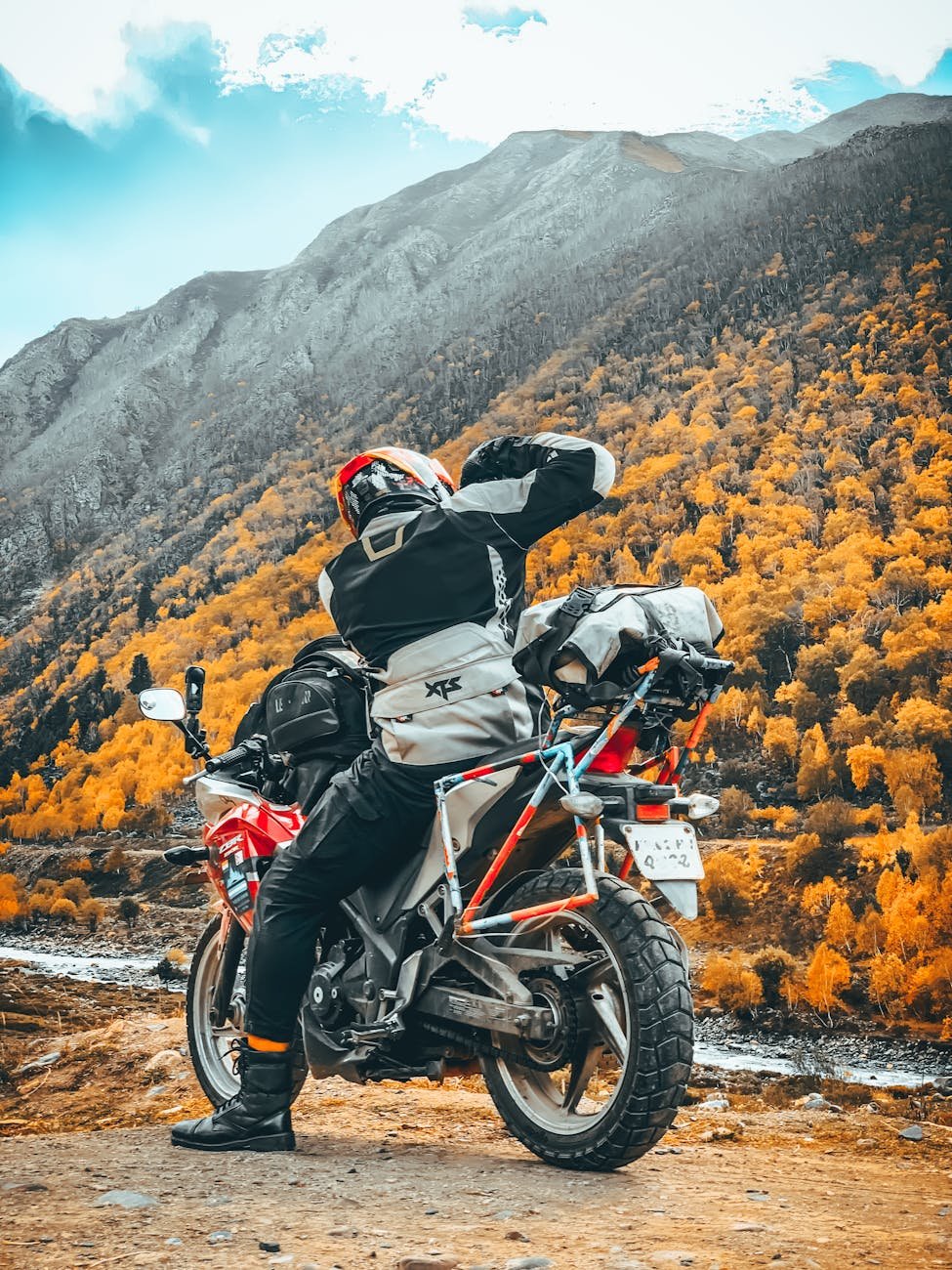 biker exploring autumn mountain landscape