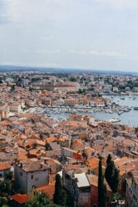 aerial view of city buildings near a harbor in croatia