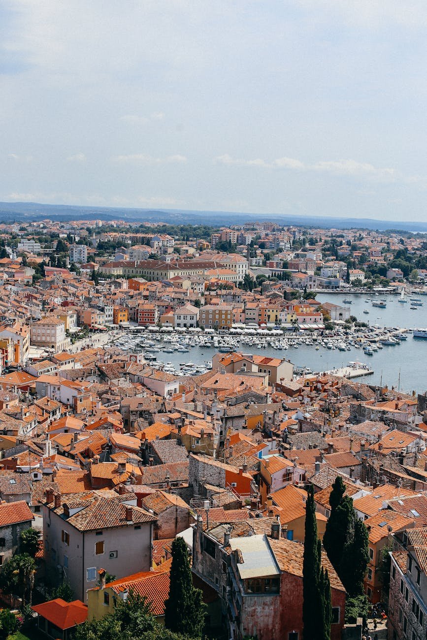 aerial view of city buildings near a harbor in croatia