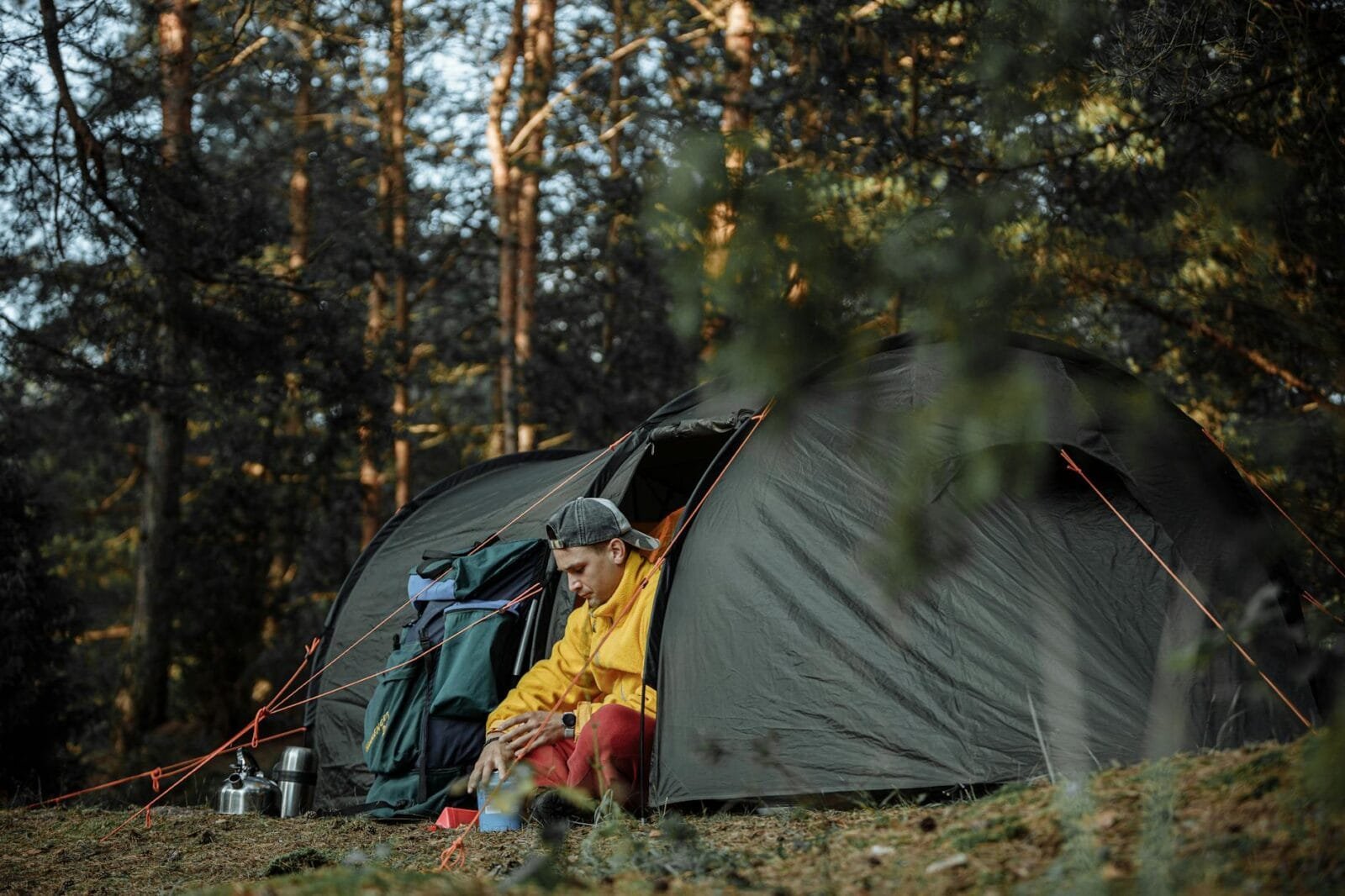 man sitting inside a tent